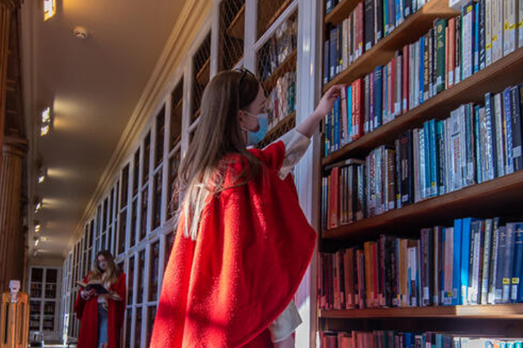 student, red gown, King James VI Library 2021